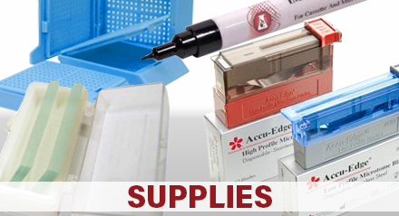 Image of microscope slides, microtome blades, cassettes, and a marker which links to the IMEB supplies page.